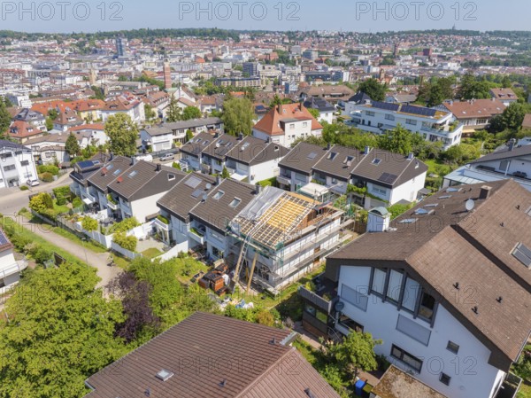 City view with focus on a renovated house roof in a residential area, roof renovation, house
