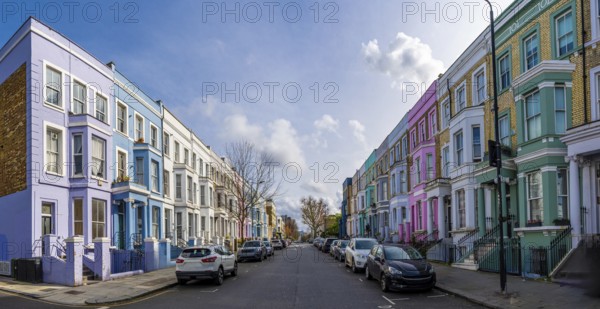 Traditional colorful terraced houses lining a street in notting hill, a popular neighborhood in