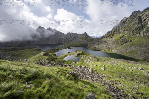 Mountain landscape with mountain lakes Wangenitzsee and Kreuzsee, cloudy mountain peaks in the