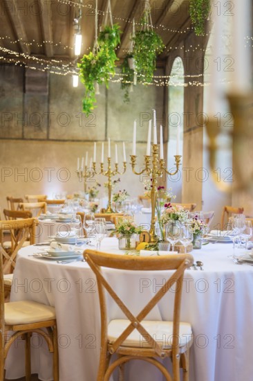 Festively decorated wedding tables with candle holders and floral decorations, event and wedding