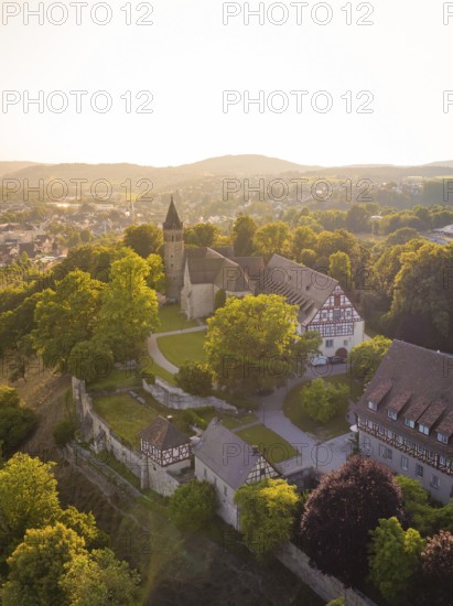 Old church and building on a hill surrounded by trees, event and wedding location Lorch Monastery,