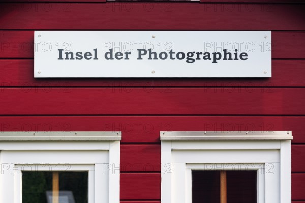 Red lobster shack, sign with inscription, Insel der Photographie, facade detail, Museum Helgoland,
