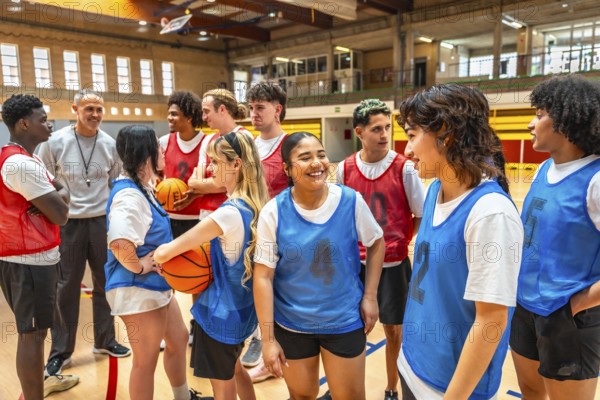High school basketball team listening to their coach's instructions during a training session in