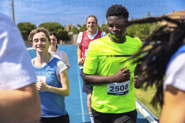 Runners competing fiercely in a race on a vibrant blue track, showcasing their determination and