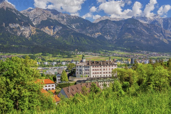 Ambras Castle on the outskirts of the city in front of the northern range of the Karwendel