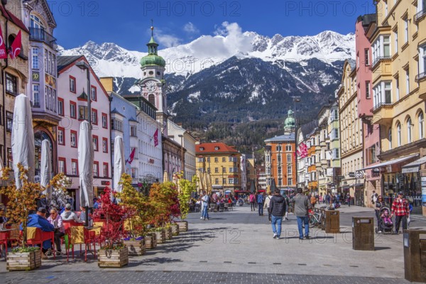Street café on the pedestrian zone Maria-Theresien-Strasse in front of the Nordkette of the