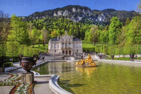 Water parterre with flora fountain and the portal of Linderhof Castle in spring, municipality of