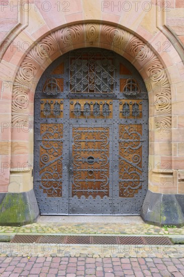 Archbishop's Ordinariate door, ornate historic door under an embossed round arch, Freiburg im