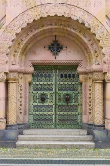Entrance to the Archbishop's Ordinariate of Freiburg, historic ornate door under a decorative round