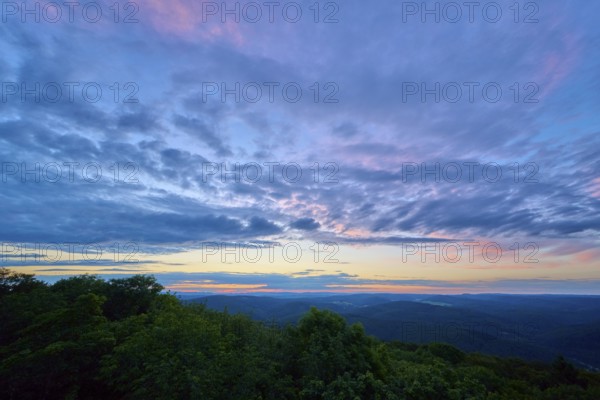 Twilight sky with purple and blue clouds over the landscape, Katzenbuckel, Waldbrunn,