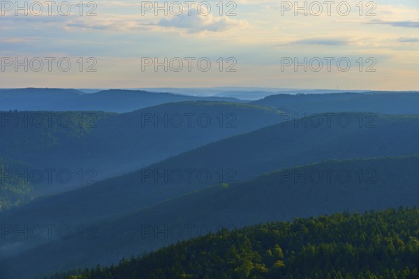 Wide mountain range at dusk, slightly illuminated sky and quiet forest, Katzenbuckel, Waldbrunn,