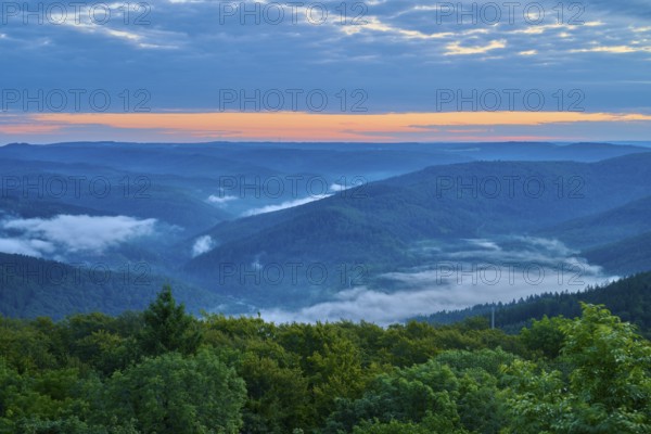 Mountain landscape with fog in the valleys at sunrise, blue sky, Katzenbuckel, Waldbrunn,