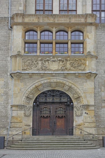 Portal with city coat of arms, town hall built in 1901, decorations, windows, Dessau,