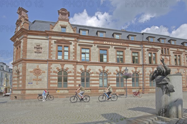 Historic post office and post office fountain with sculpture symbolising the Silent Post, fountain,