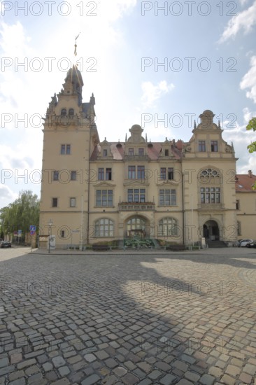 Town hall in neo-renaissance style with backlight, sunbeams, Bernburg, Saxony-Anhalt, Germany