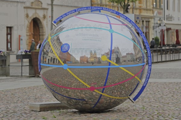 Metal ball with reflection and inscription Note to link digital mobile device, smartphone,