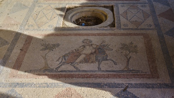 Ancient mosaic depicting a man and a horse surrounded by geometric patterns, House of Beluga
