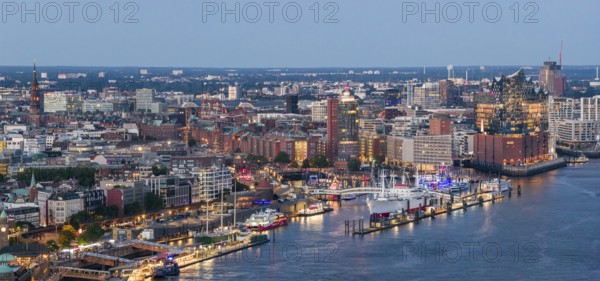 Panoramic aerial view of the Landungsbrücken in the harbour at blue hour with the Elbphilharmonie