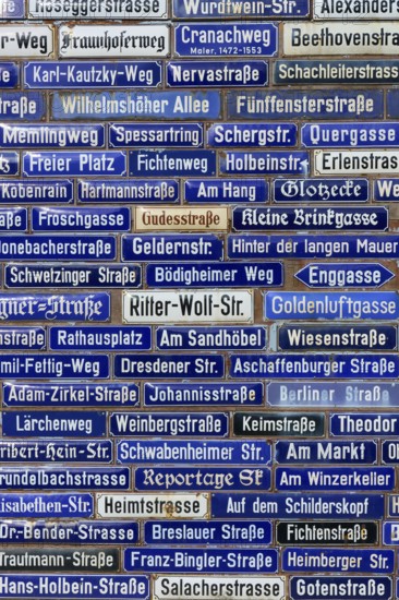 Compact collection of blue street signs with numerous street names, Amorbach, Odenwald, Bavaria,