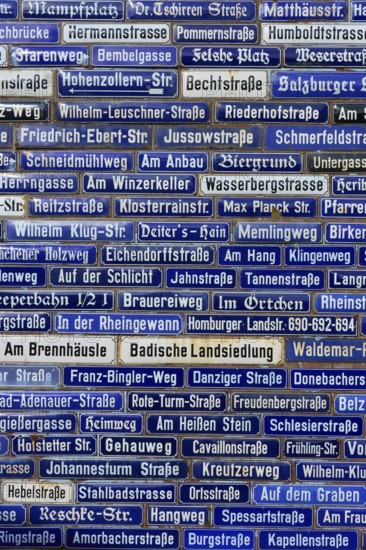 Blue street signs with a variety of names, Amorbach, Odenwald, Bavaria, Germany