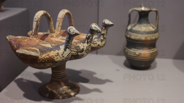 Ceramic vessel with triple bird's head design, artistically decorated, Archaeological Museum, Kos