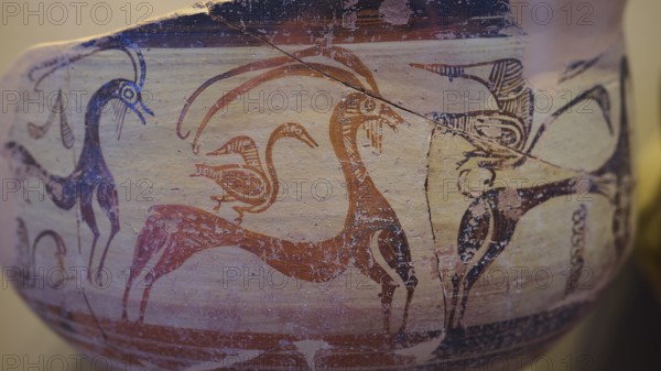 Antique vase with geometric art motifs of goats and birds in red and beige, Archaeological Museum,