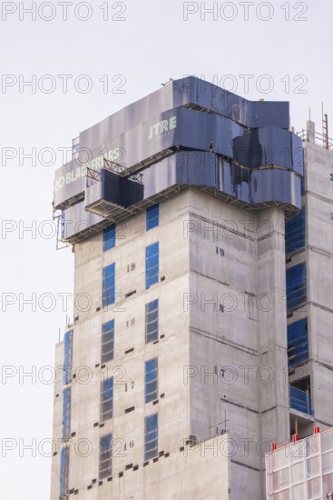 Partially finished high-rise building under construction with modern architectural design, London,