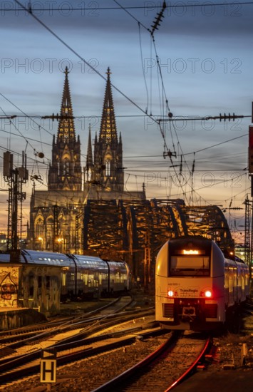 Rail track in front of Cologne Central Station, Hohenzollern Bridge across the Rhine, regional