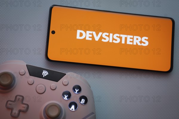 Dhaka, Bangladesh- 22 March 2025: Devsisters logo displayed on a smartphone surrounded by gaming