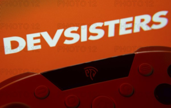 Dhaka, Bangladesh- 24 Mar 2025: A close-up of a gamepad with the Devsisters seen on screen in the