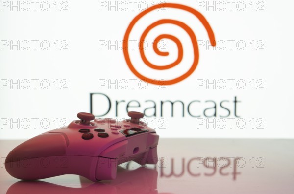 Dhaka, Bangladesh- 20 Mar 2025: A close-up of a white gamepad with the Dreamcast seen on screen in