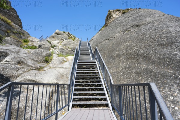 Rocky landscape with stairs and bright blue sky, Uplistsikhe cave town, Uplistsikhe, Inner Kartli