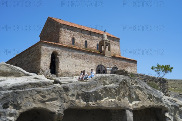 Ancient brick church on rocks, historical architecture in natural surroundings, 10th century