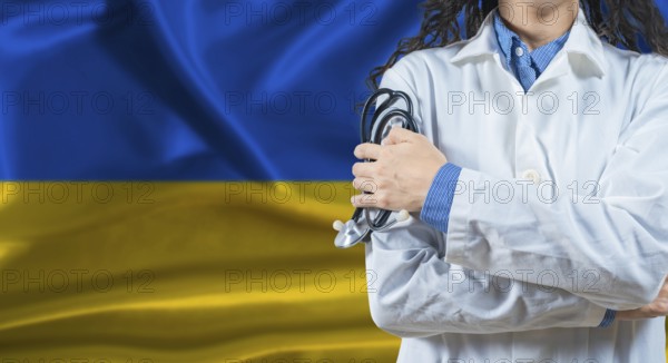 Healthcare professional with Ukraine flag background. Professional doctor holding stethoscope on