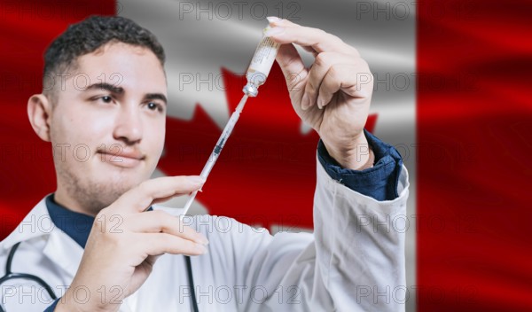 Doctor holding syringe on Canada flag background. Medical professional holding syringe with