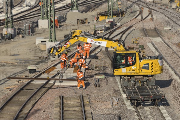 Track construction in progress using a large yellow construction machinery vehicle, Untertürkheim