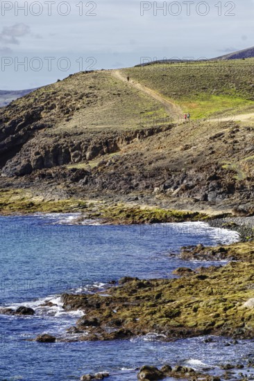 Coast with rugged hills and a hiking trail that snakes through the countryside, Puerto Calero