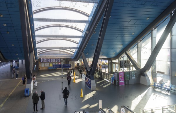 View from escalator of modern architecture of railway station concourse building, Reading,