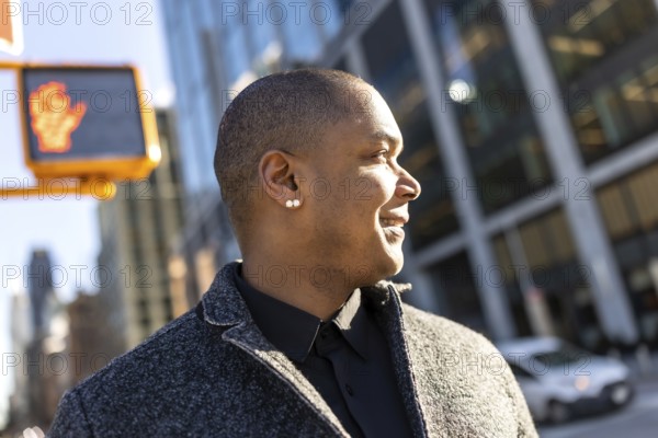 Professional man confidently walking through the vibrant city streets, looking ahead with a happy