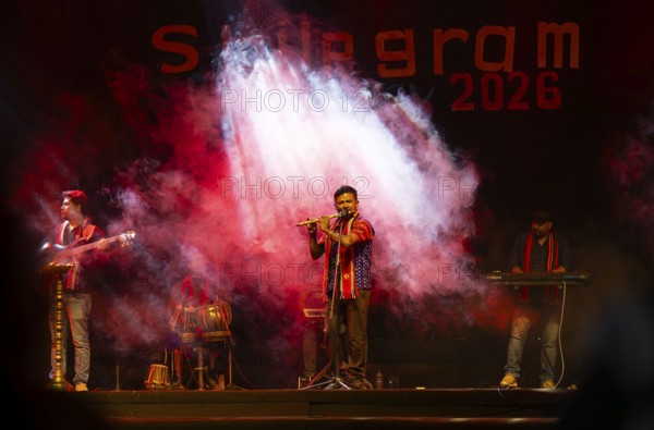 Flutist Dilip Hira performs during a cultural evening program at Shilpgram Mohotsav 2026 in