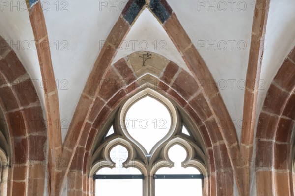 Gothic window, fountain chapel, connected to blue by monastery canal, Blaubeuren Abbey, Swabian