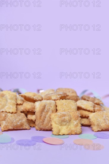 Rhenish pastries called 'Mutzen pastries or Muzenblätter' with powdered sugar on festive background