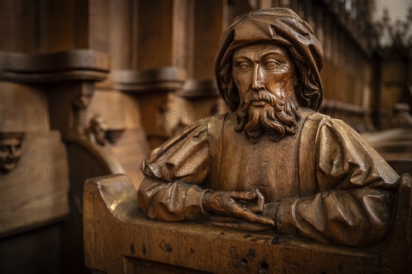 Carved half-figure, man with beard, oak choir stalls for monks' hour prayers, 1493 by Jörg Syrlin
