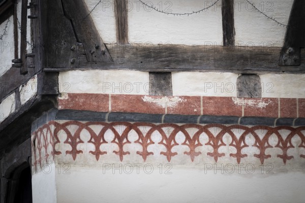 Reddish, painted decorative elements on an old half-timbered house, Blaubeuren Abbey building,
