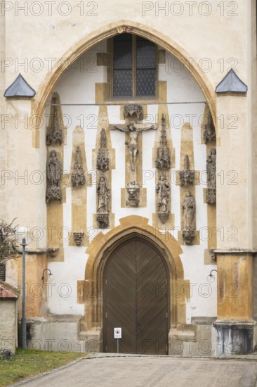 Christ sculpture and remains of the former monastery church of S. Johannes Baptistam above portal