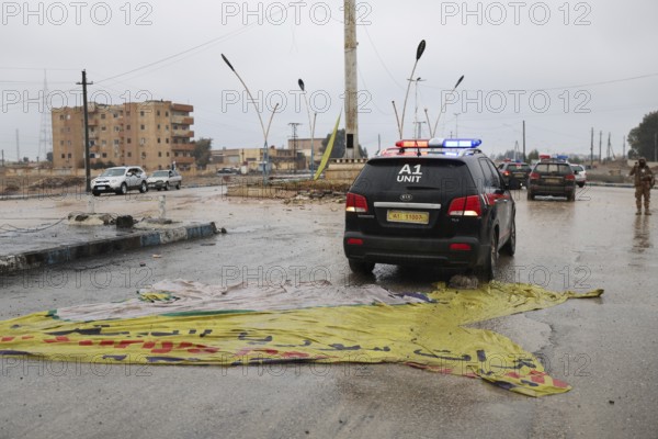 In Raqqa, Syria on January 18, 2026, a convoy of Syrian Government forces is seen advancing through