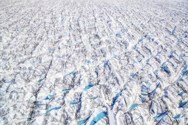 Aerial view of meltwater on the Greenland ice sheet, Arctic landscape, frozen wilderness, glaciers
