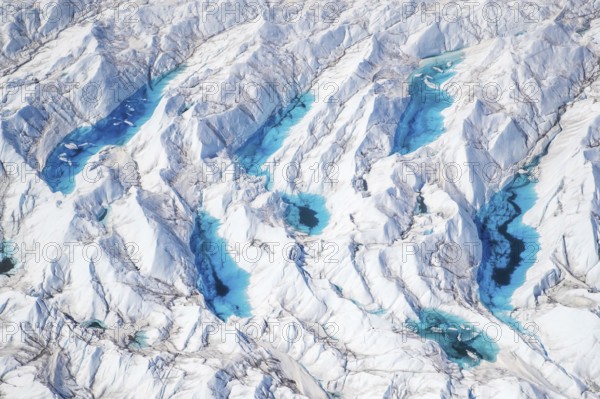 Aerial view of meltwater on the Greenland ice sheet, Arctic landscape, frozen wilderness, glaciers