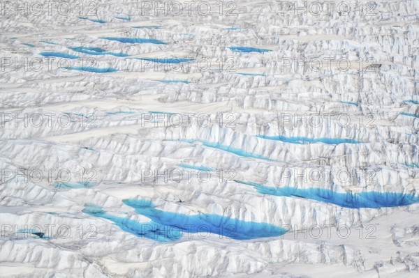Aerial view of meltwater on the Greenland ice sheet, Arctic landscape, frozen wilderness, glaciers