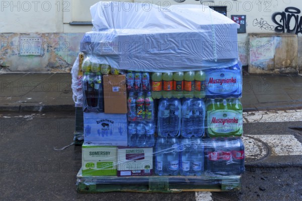 Pallet with drinks, covered in case of rain, Krakow, Poland